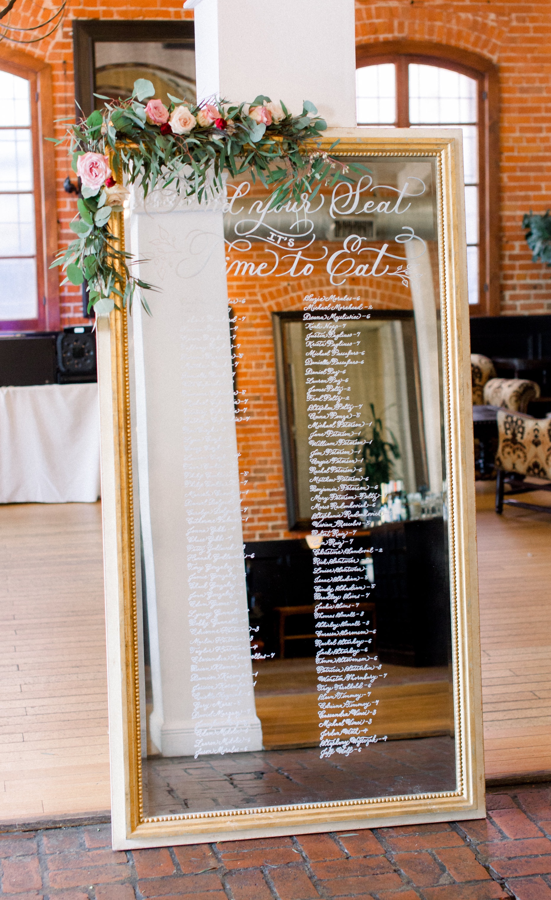 Los Angeles calligraphy on mirror seating chart