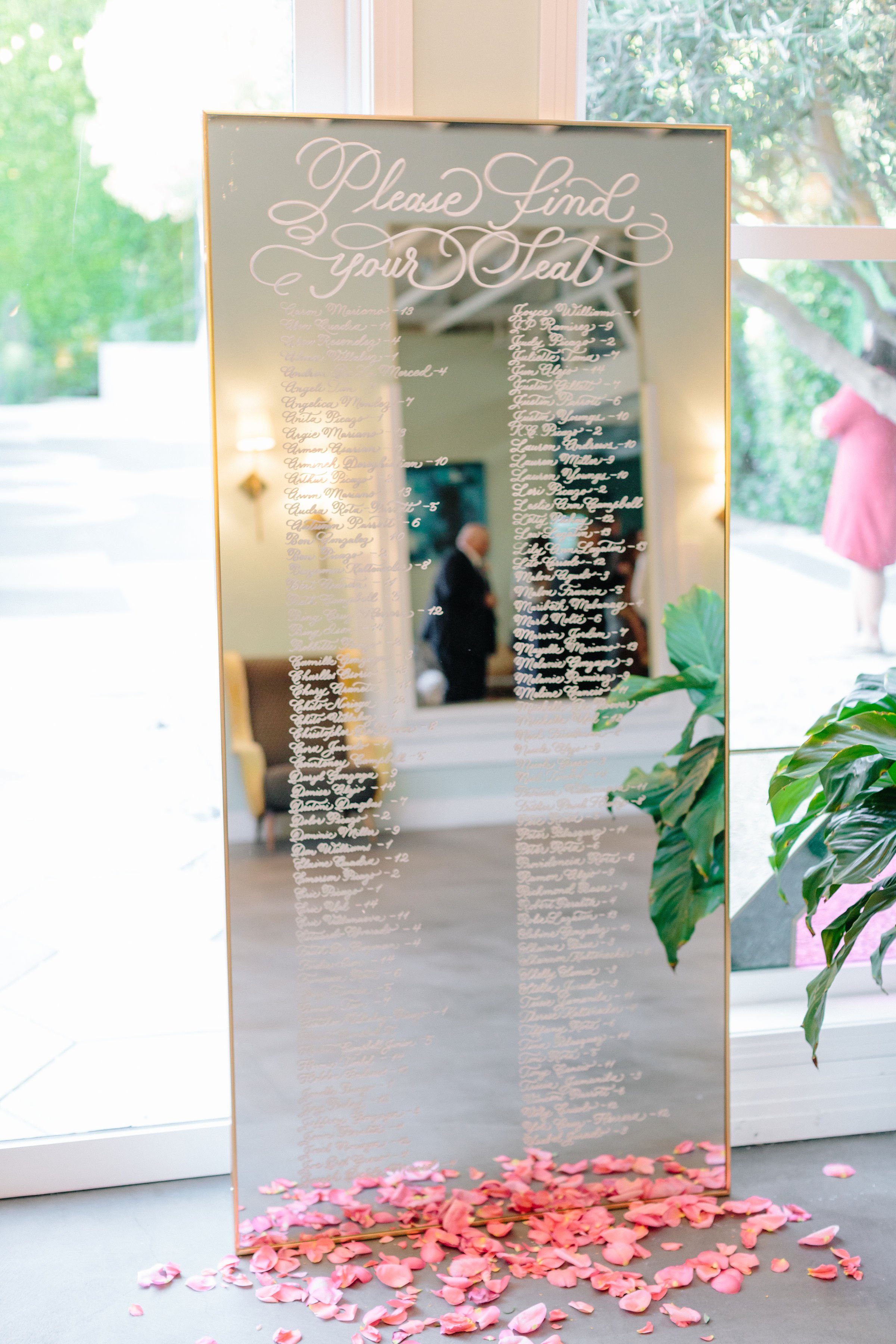 Los Angeles calligraphy on mirror seating chart