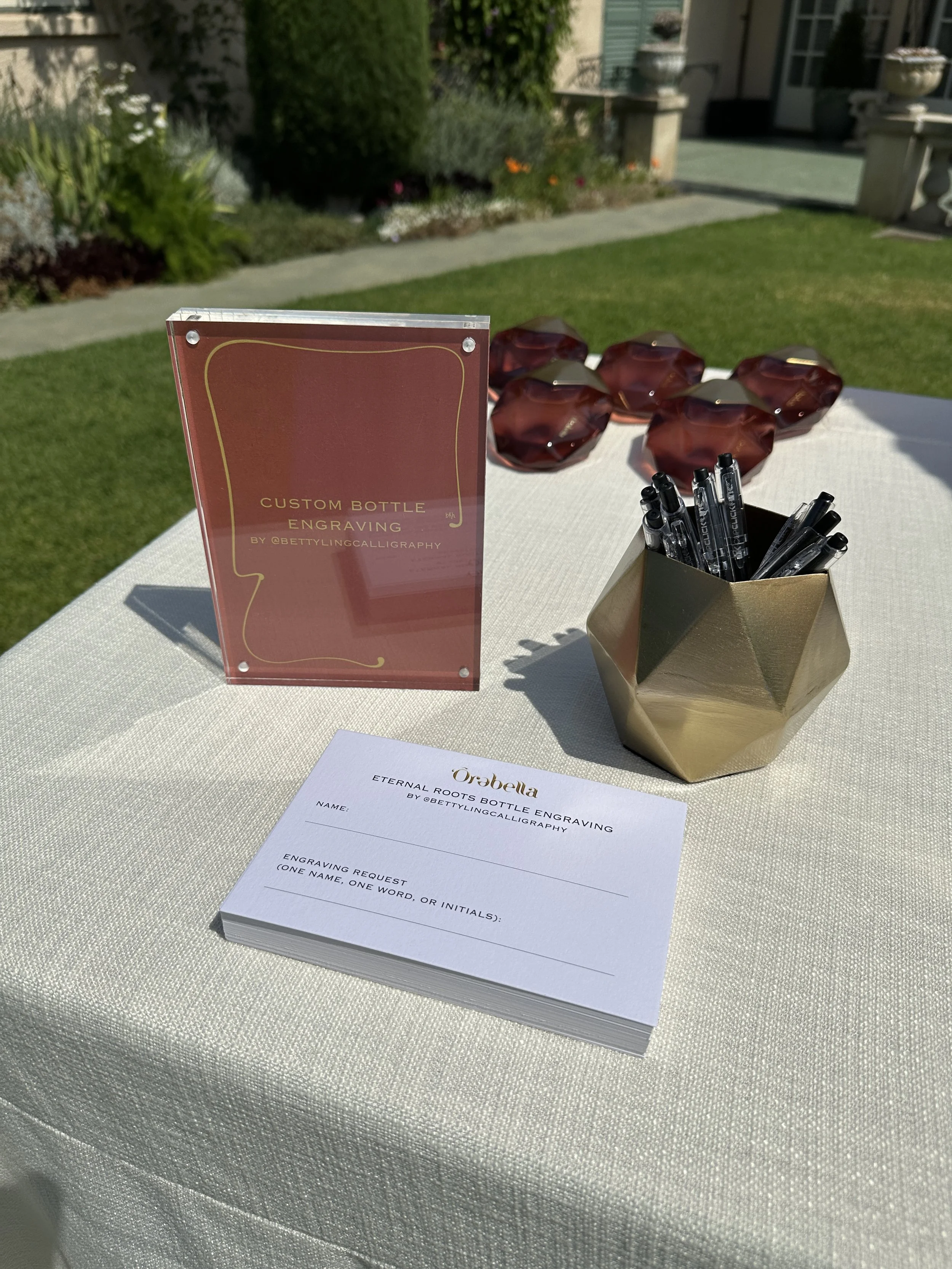  Betty Ling Calligraphy engraved perfume bottles for Orebella fragrances in Beverly Hills with guest names, filled with gold to match the brand’s logo. 
