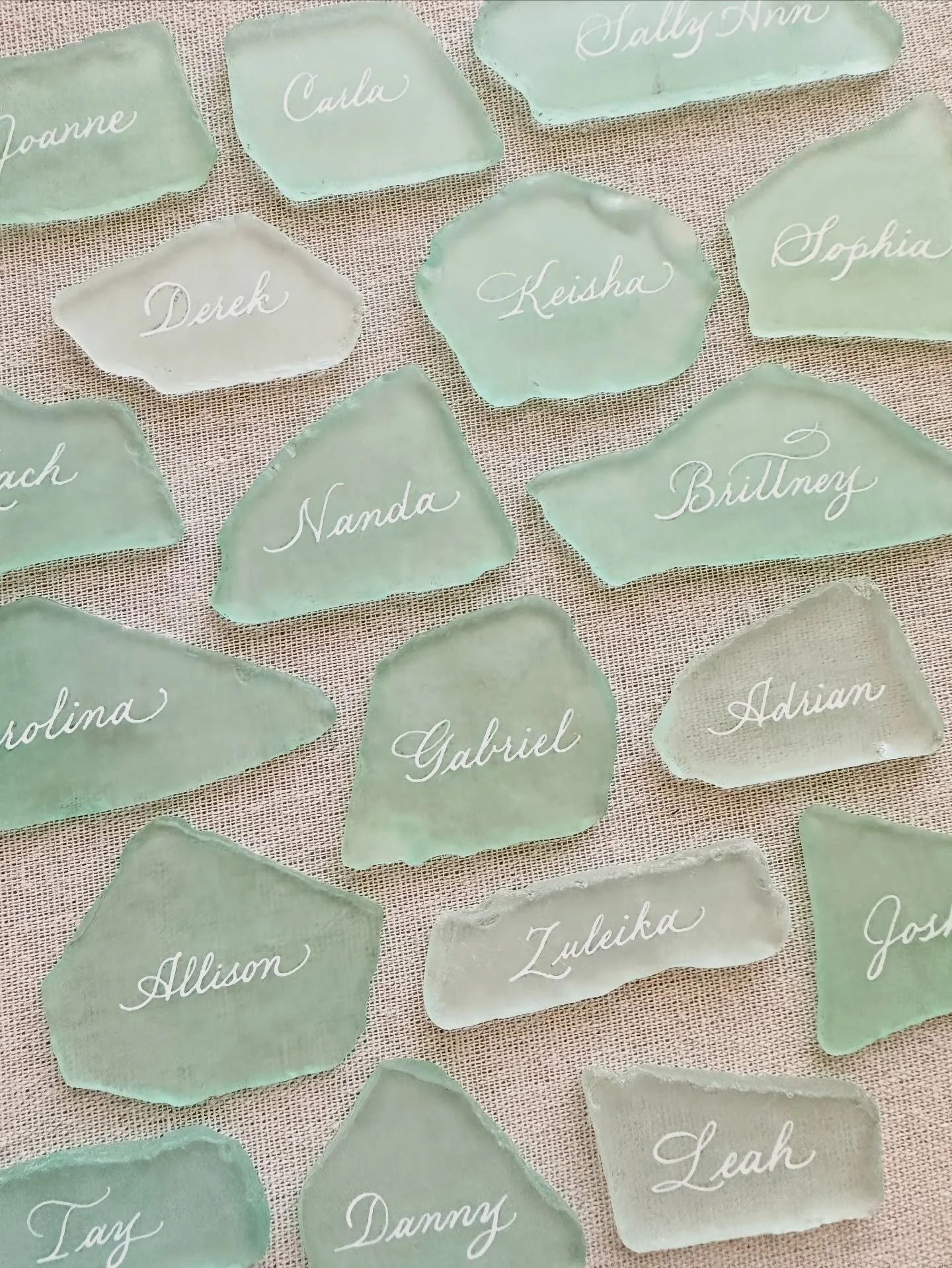Unique place cards: Sea Glass 

See the next slide for the real time hand written calligraphy on the glass. As a calligrapher, I need to write with a very light hand and very slowly to avoid ink blobs, since glass is non-porous. 

#placecard #seaglas