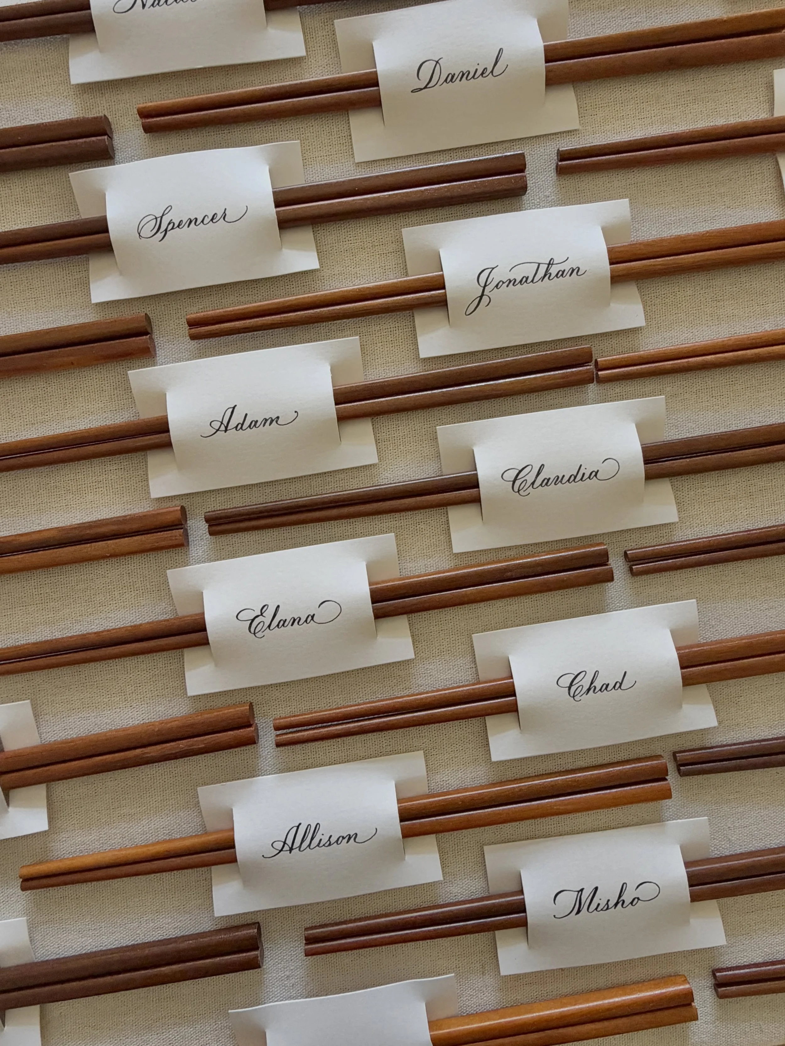 Love it when a creative idea comes around again. ❤️

Custom chopstick place cards, hand written and hand cut for a private celebration. 🎉 

#losangelescalligrapher #placecard