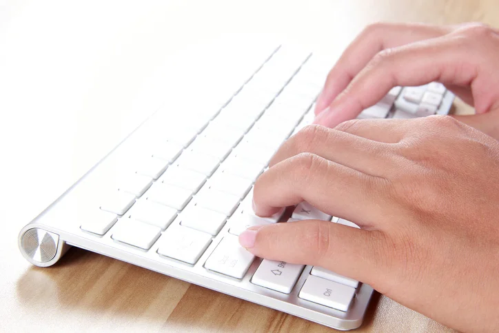Female-hand-typing-with-keyboard-896752850_727x484.jpg