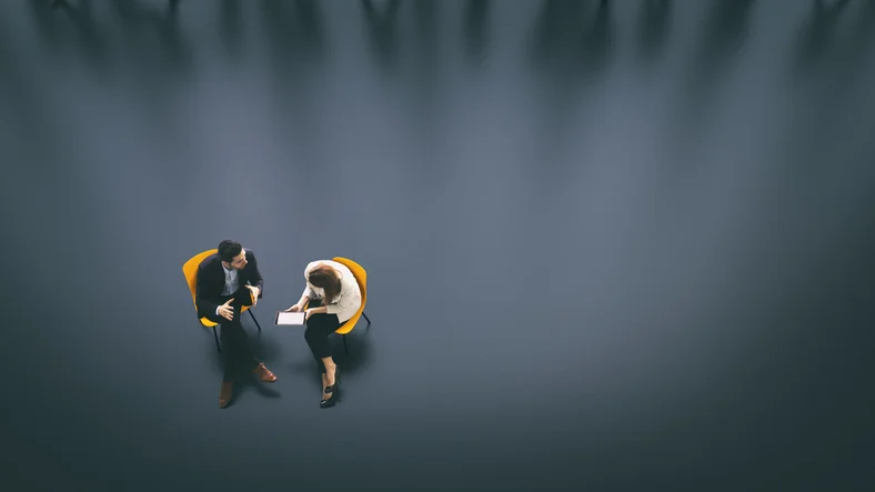 Overhead view of two business persons in the lobby - Stock image.jpg