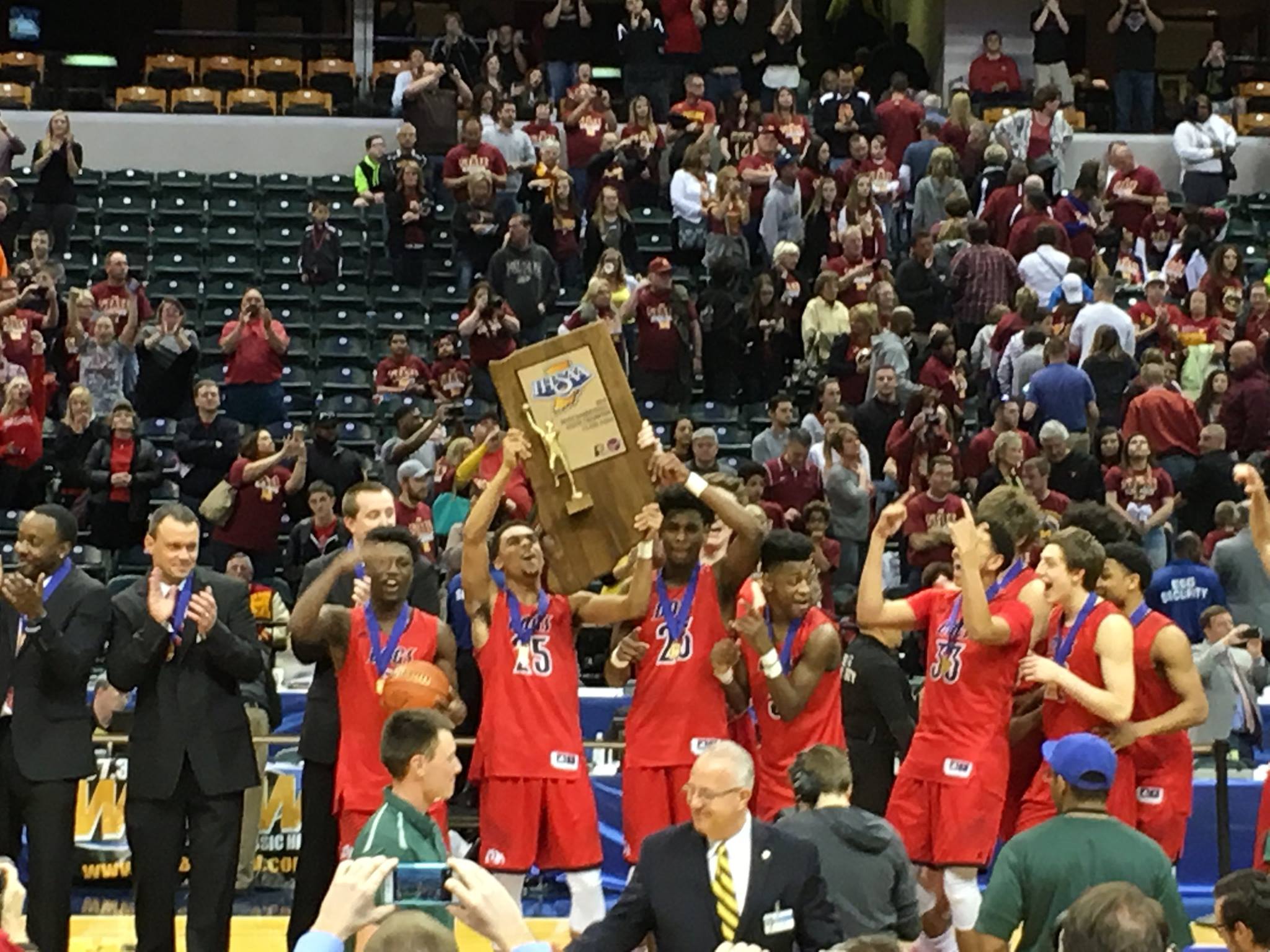The Bulldogs hold up their first state championship since 1973.