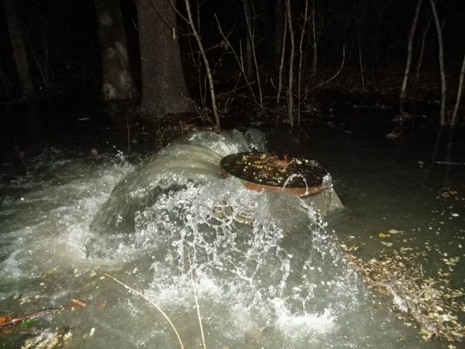 A Sanitary Sewer Overflow occurs through a manhole.