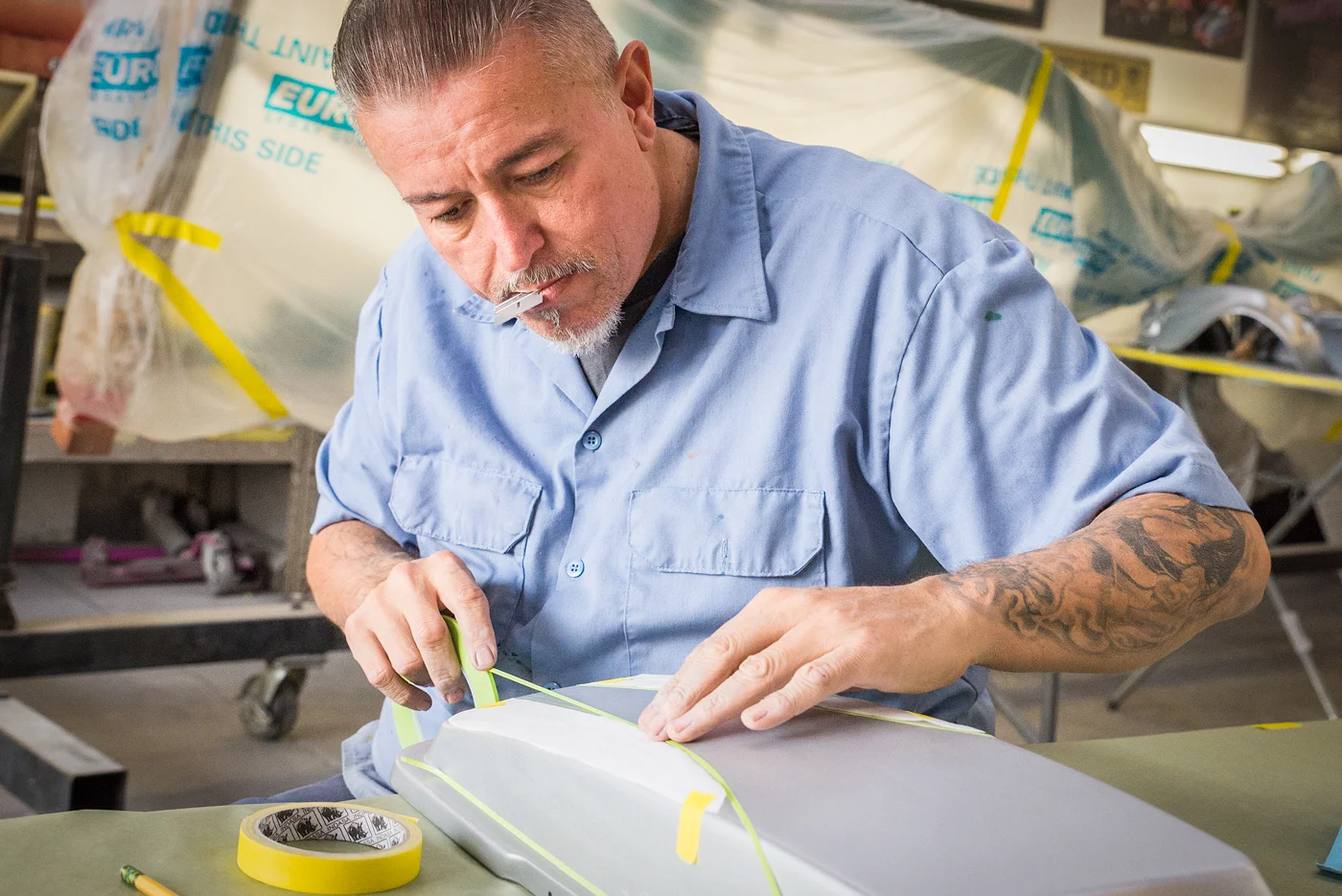 Daniel Galvez, known as Danny D, prepares another layer of paint on a repair and repaint of a motorcycle. The motorcycle will ultimately be candy red - a semi-translucent red-tinted finish - and pinstriped. Galvez is owner and operator of Danny D Studios, a custom paint and pinstripe shop, known worldwide for his elaborate paint and customizations. His first lowrider was a hand-me-down bicycle when he was growing up in East L.A. and first lowrider car that he built himself was a Chevrolet El Camino. ARASE / PHOTOGRAPHING 'SLOW AND LOW'