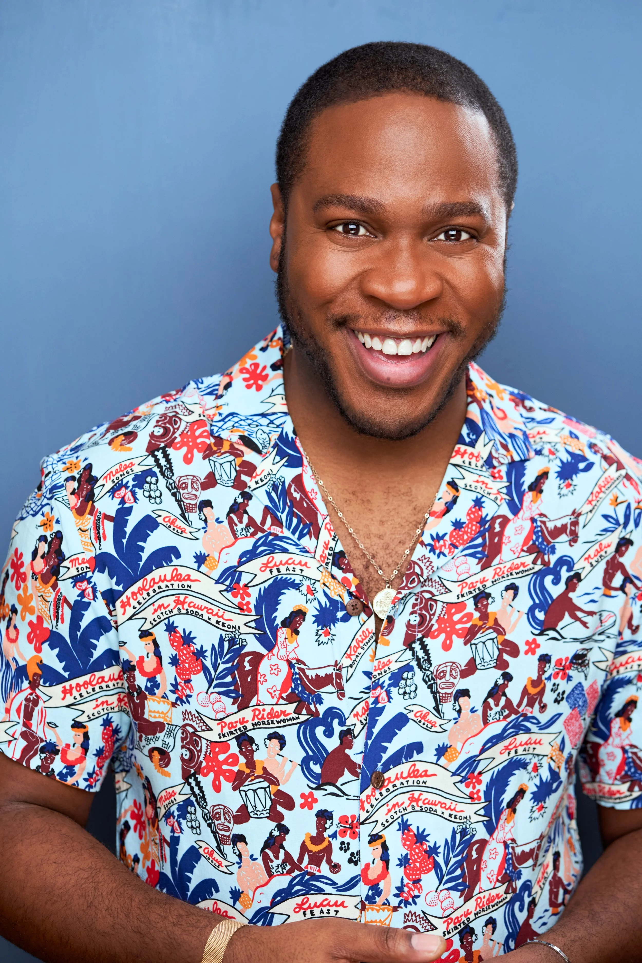 Colorful shirt Blue Headshot.jpg