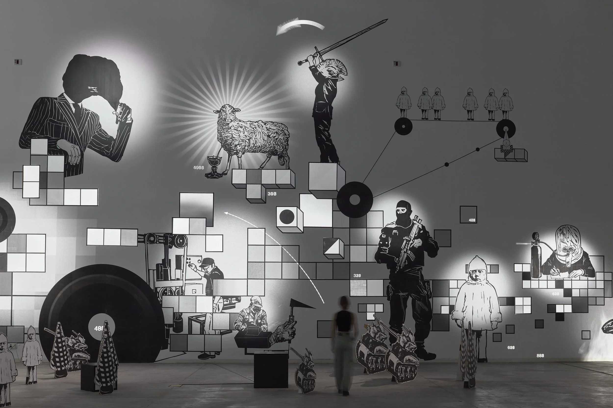 Large-scale installation by Fred Penelle and Yannick Jacquet combining woodcut imagery and scenographic composition