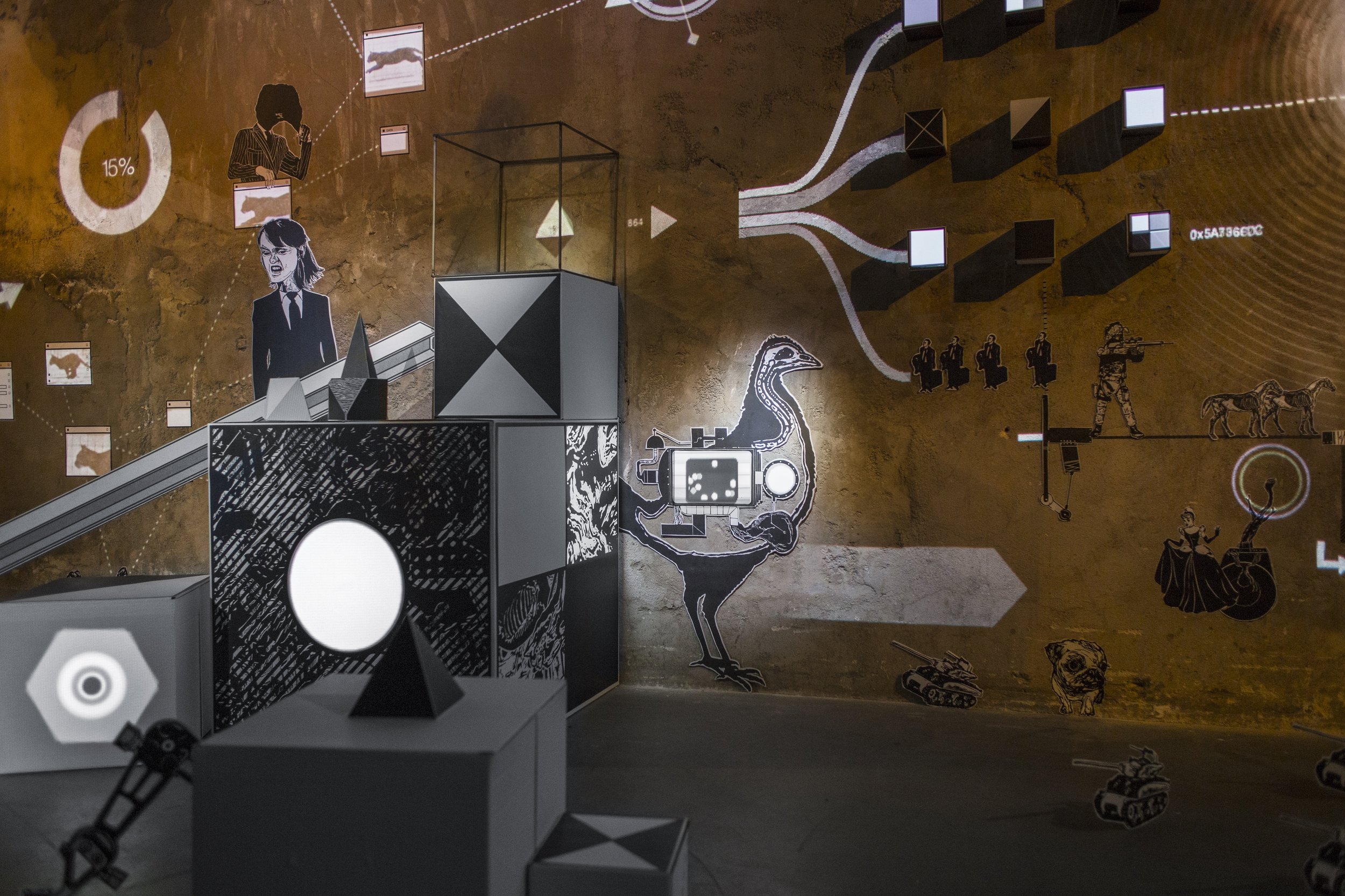 Mécaniques Discursives - Close-up of visual composition integrating wall graphics and three-dimensional elements