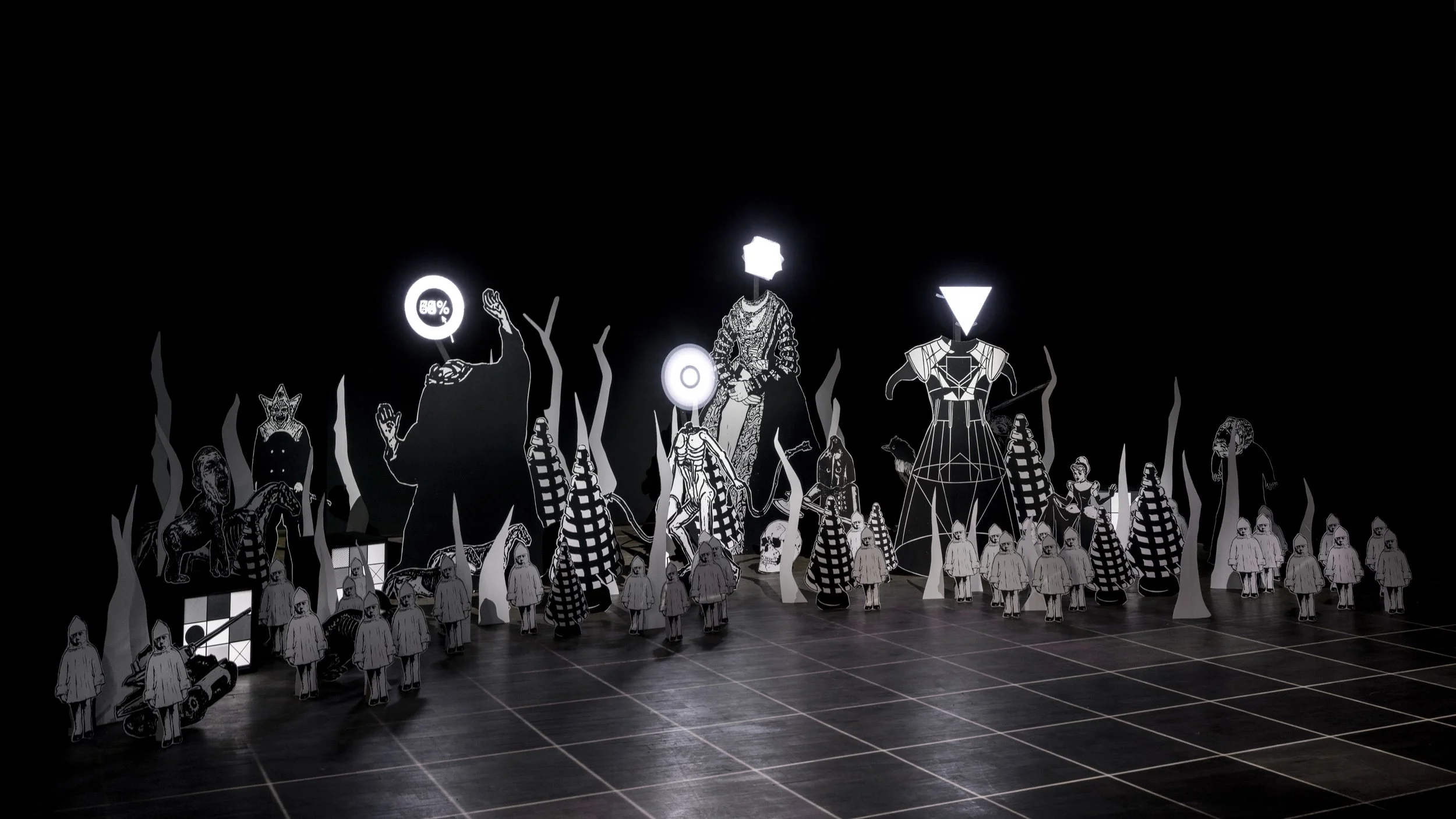 Sarabande en Temps de Crise installation by Fred Penelle and Yannick Jacquet combining cut-out figures, projection and scenographic composition
