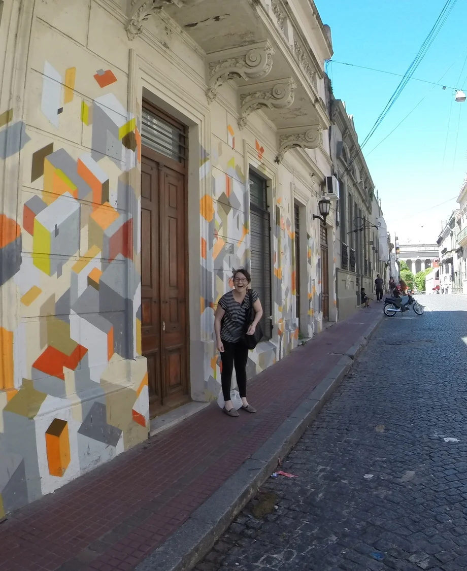 Nikki in front of a mural