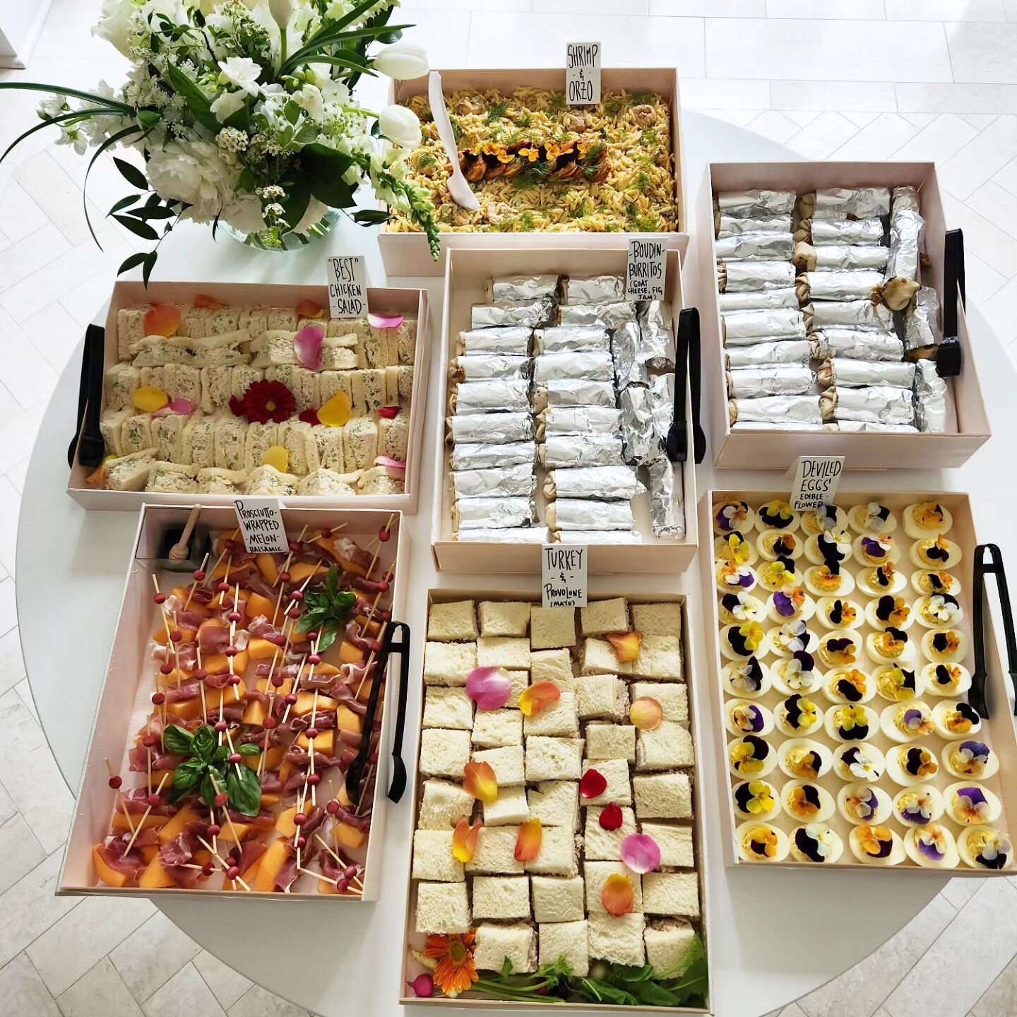 Like a puzzle, sometimes all the pieces fit perfectly. Except for the coot board - she needed her own table 😉. Pop-up market bites for @figanddove.

#boudinburritos 
#prosciuttowrappedmelon 
#shrimpandorzopasta 
#teasandwiches
#deviledeggsbutmakeemc