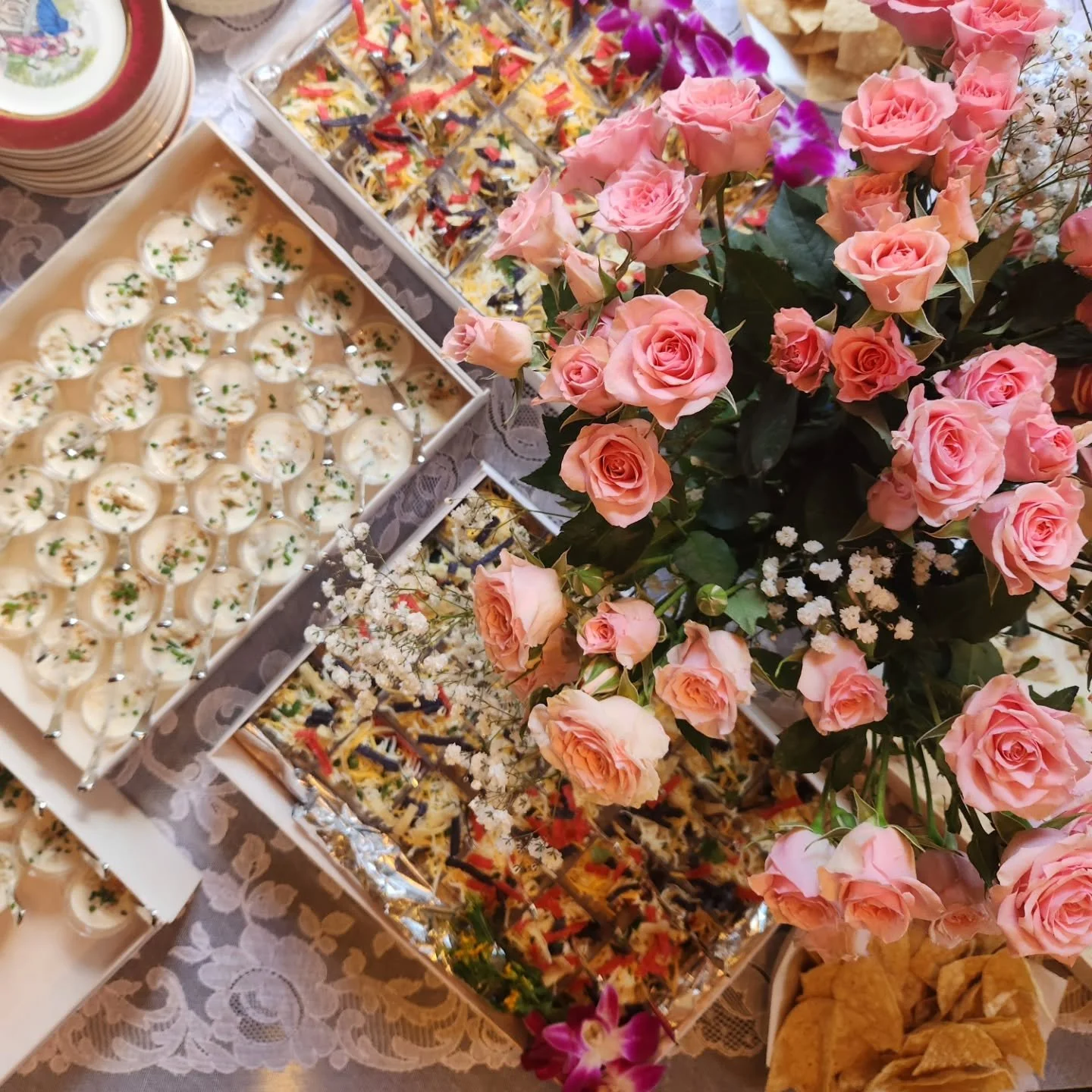 A French Quarter soiree. Complete with varied chinaware, small bites, and big roses.

#nellstogo 
#nellscateringco 
#showering 
#nolacatering