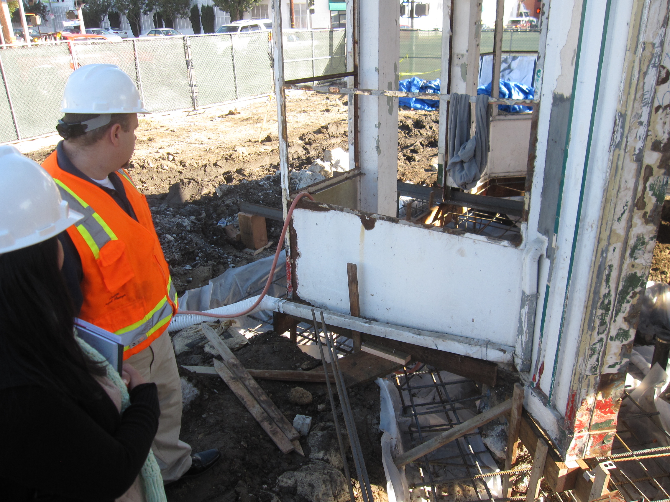  Spectra representative Ruben Lombardo and Valerio representative Elfa Gomez inspect new foundation and exterior finishes under contruction. 