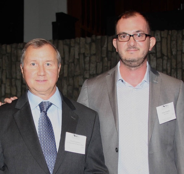 Daniel Swienton (left), project manager at U.S. Department of Veteran Affairs and Nicos Katsellis (right), Director of Operations and Senior Associate at Leo A Daly accept the award for VA West LA, Building 209.
