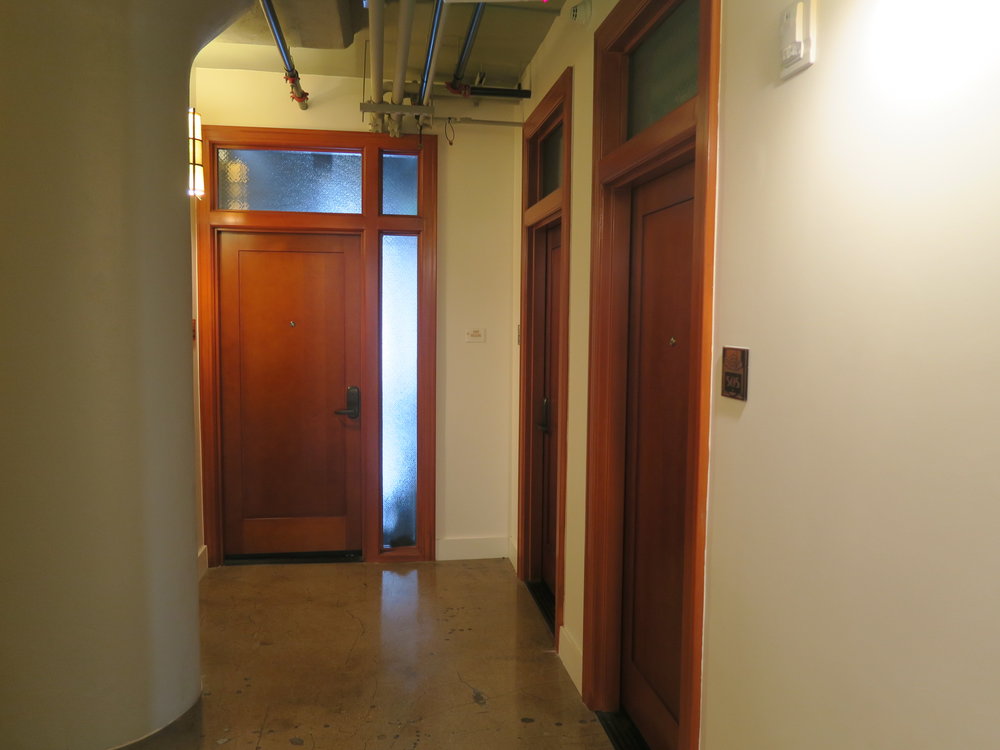 Interior wood doors from corridor, after rehabilitation.