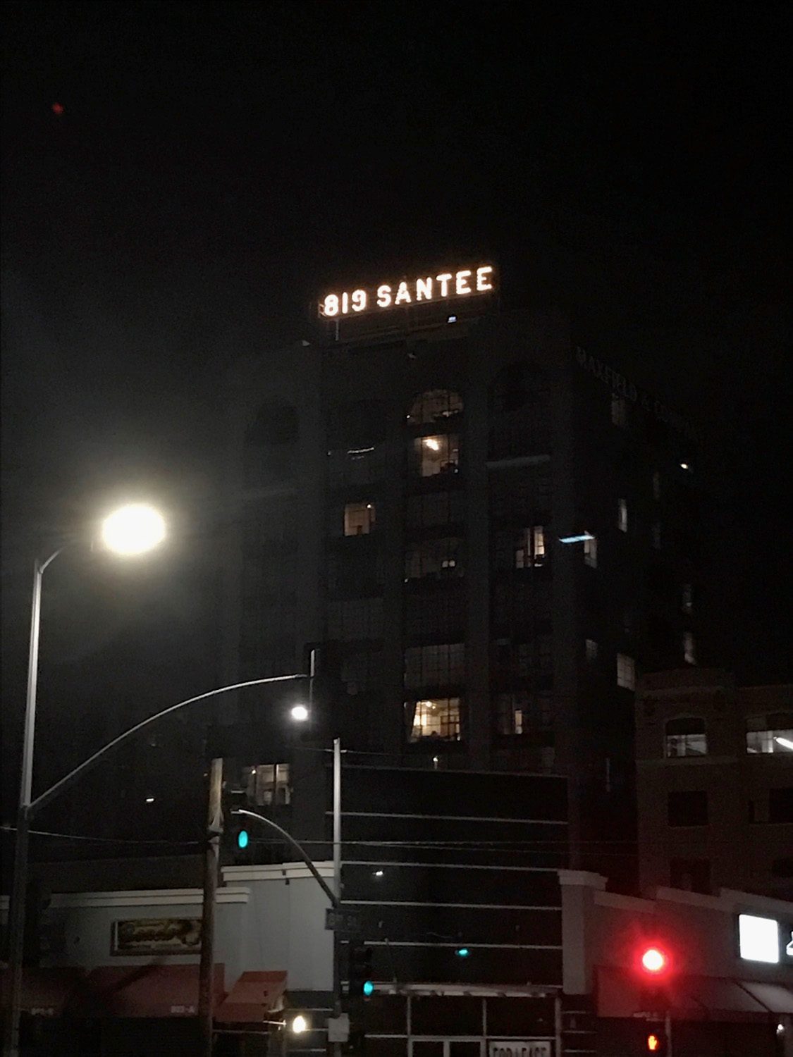 Rooftop sign after rehabilitation, at night.
