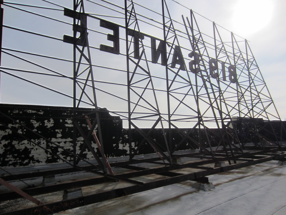 Rooftop sign before rehabilitation.