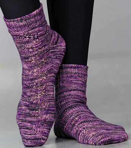 Licorice Laces (Creative Knitting Magazine, April 2015 Special: Just in Time Knits, featuring Candy Skein Yummy Fingering): a toe-up, fleegle heel sock with mirrored lacework.