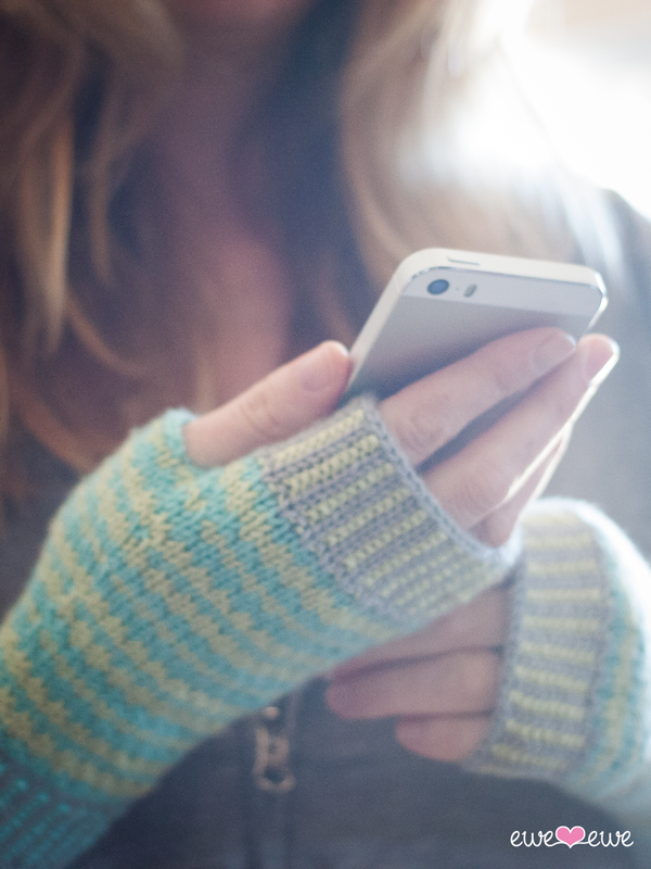 Techie Twosome (Ewe Ewe Yarns, featuring Ewe So Sporty): fingerless mitts knit in the round; these mitts are made identical to one another and feature slipped stitches, a gusset thumb and corrugated ribbing at the cuff and fingers.