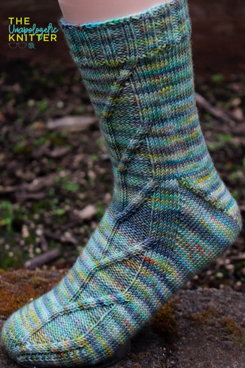 White Hart - Toe-up hand knit socks featuring a Fleegle heel and a traveling stitches pattern on the front of the sock