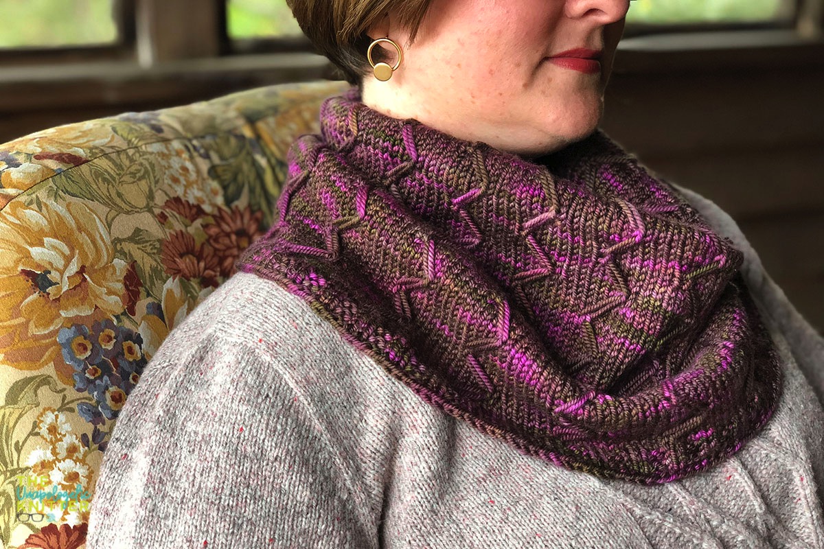 Cabin Rose - a worsted weight tapered cowl knit with graphic elongated stitches.