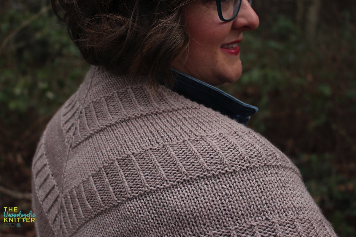 Hand knit shawls in 2 shapes and sizes featuring a repeating textural pattern.