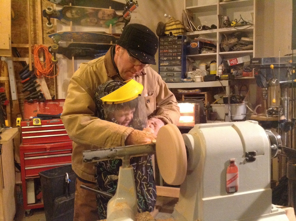 Mike O'Brien at home woodworking with his son. 