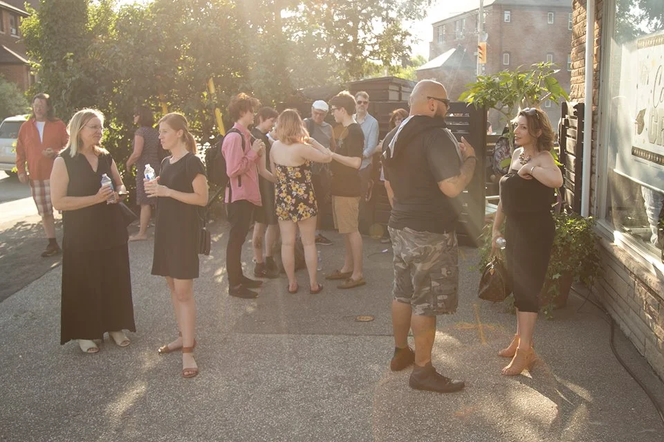 Parents, family and friends enjoying the hot summer evening outside