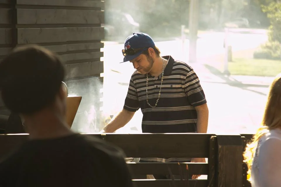Jason, spending some hot time at the BBQ to feed the group!  