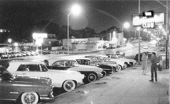  Hot rods and custom cars line Congress Ave 