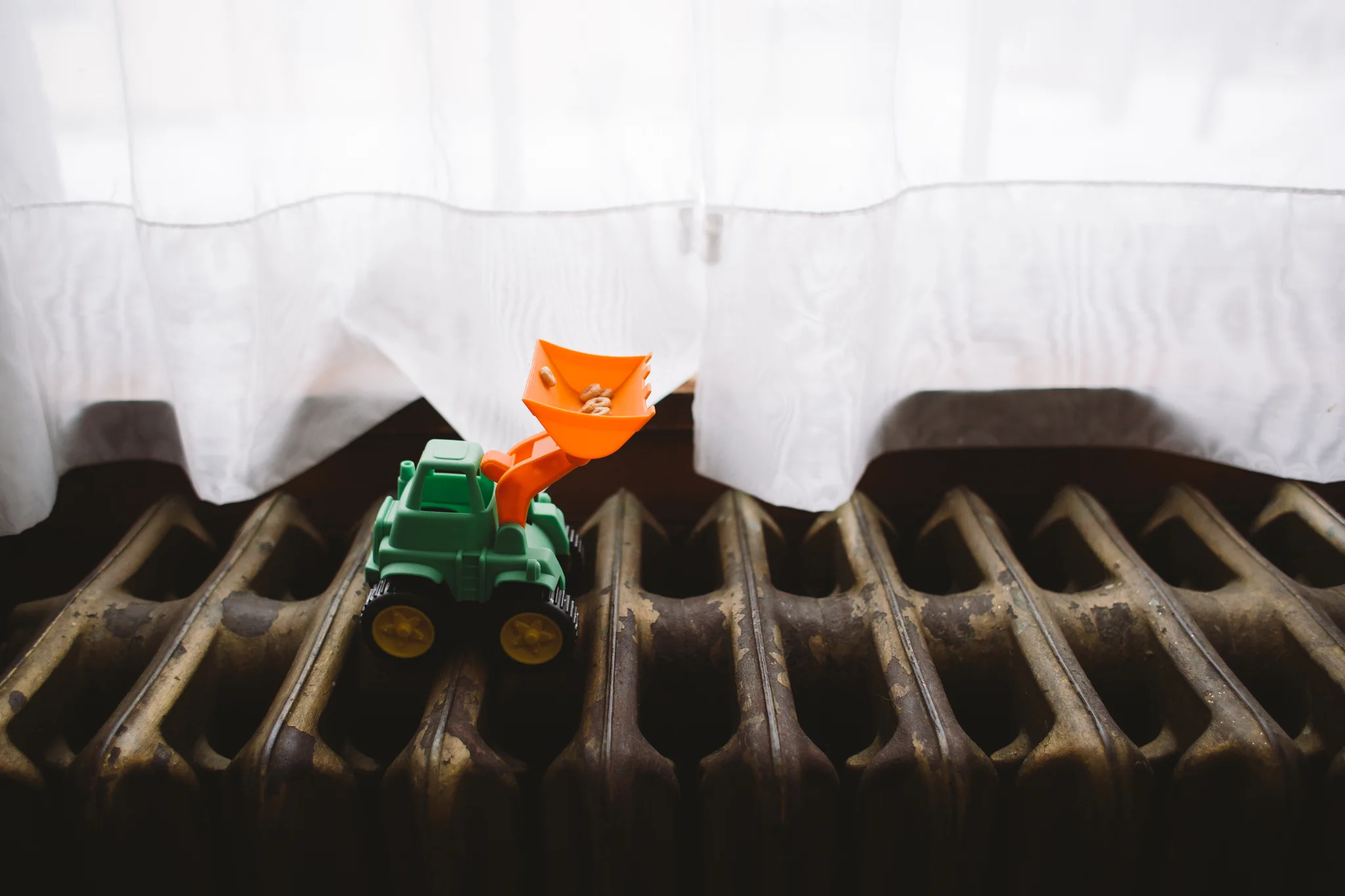 14/366 | I love finding Finn's random little surprises all over the house. Cheerios in his digger on the heater. 
