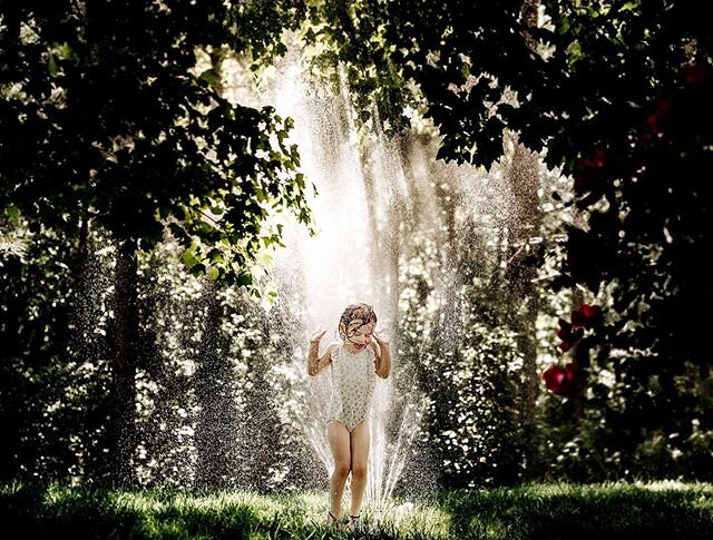 She moved the sprinkler to this spot in the yard &amp; began a dance party. Zack was about to make her move it back and I said, &ldquo;Nooope. Pause.&rdquo; 🌞💦 #clickinmoms #lookslikefilm #cameramama #charlottephotographer #cltphotographer #ballant