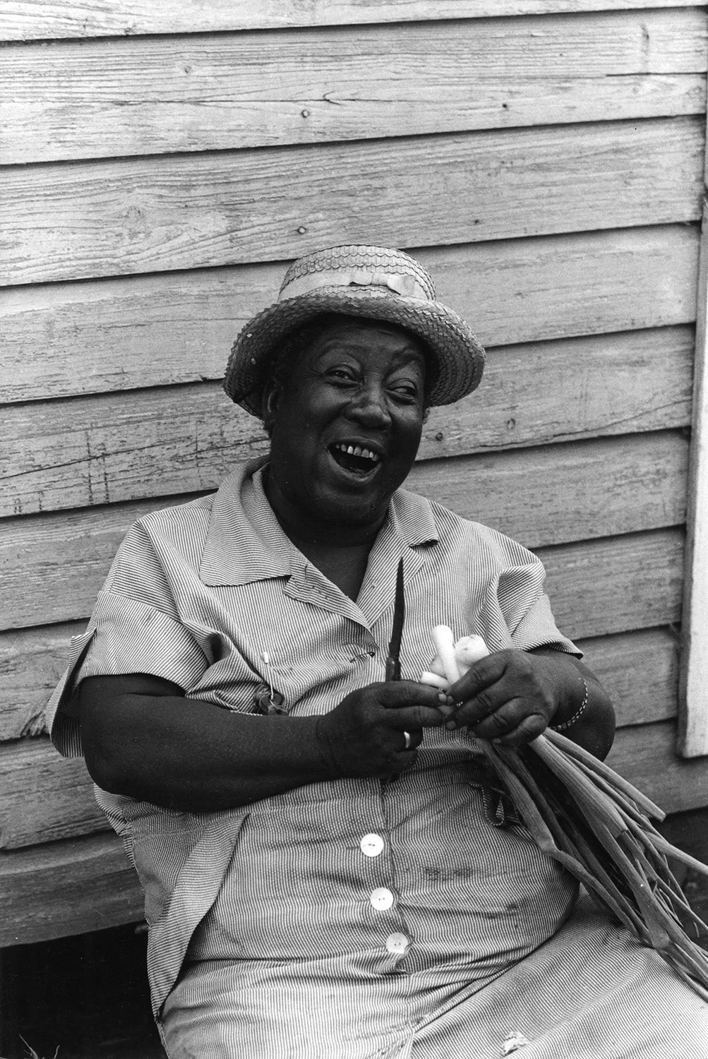 Battles' Quarters, woman slicing onions outside her house