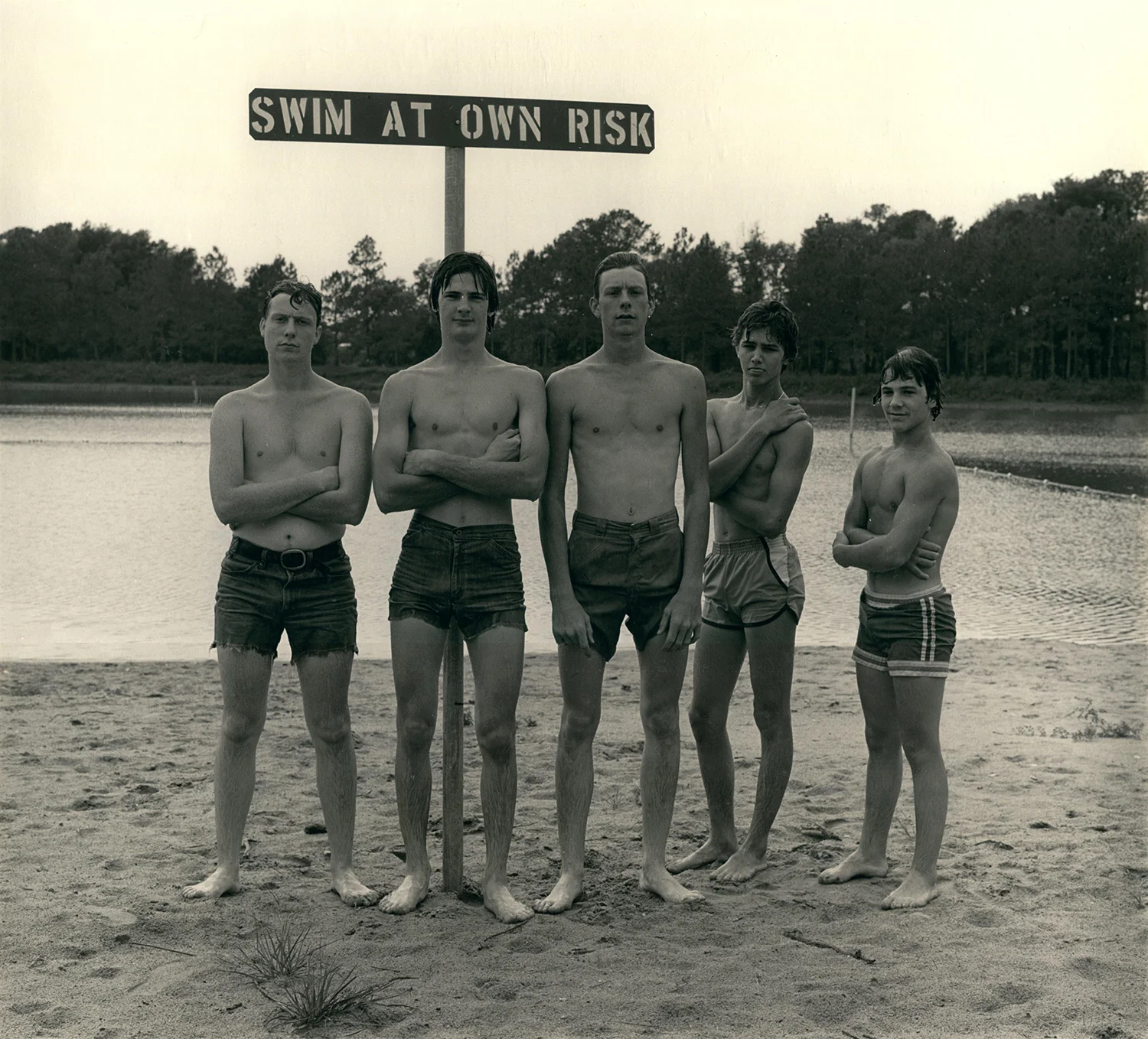 Boys Under sign at Boat Basin Beach