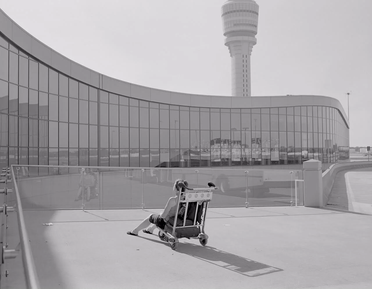 Untitled (woman on luggage cart, Atlanta airport)