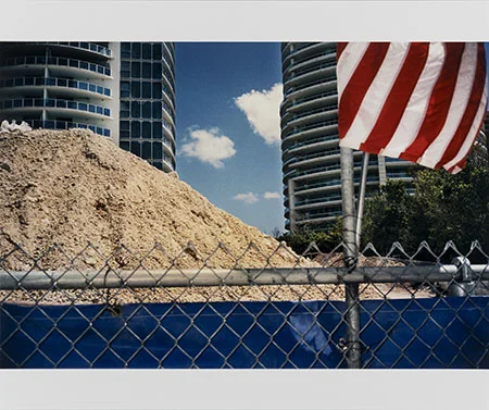 WILLIAM GREINER (American, 1957) Buildings with Flag, Miami , 2004 Edition: 4/25 16 x 24 in. — Image Size The Do Good Fund, Inc., 2018-022