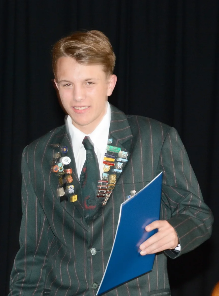 Outstanding Staples Scholarship recipient, Liam Jacobson, at Dilworth's end of year Senior School Prize Giving....the badges say it all.
