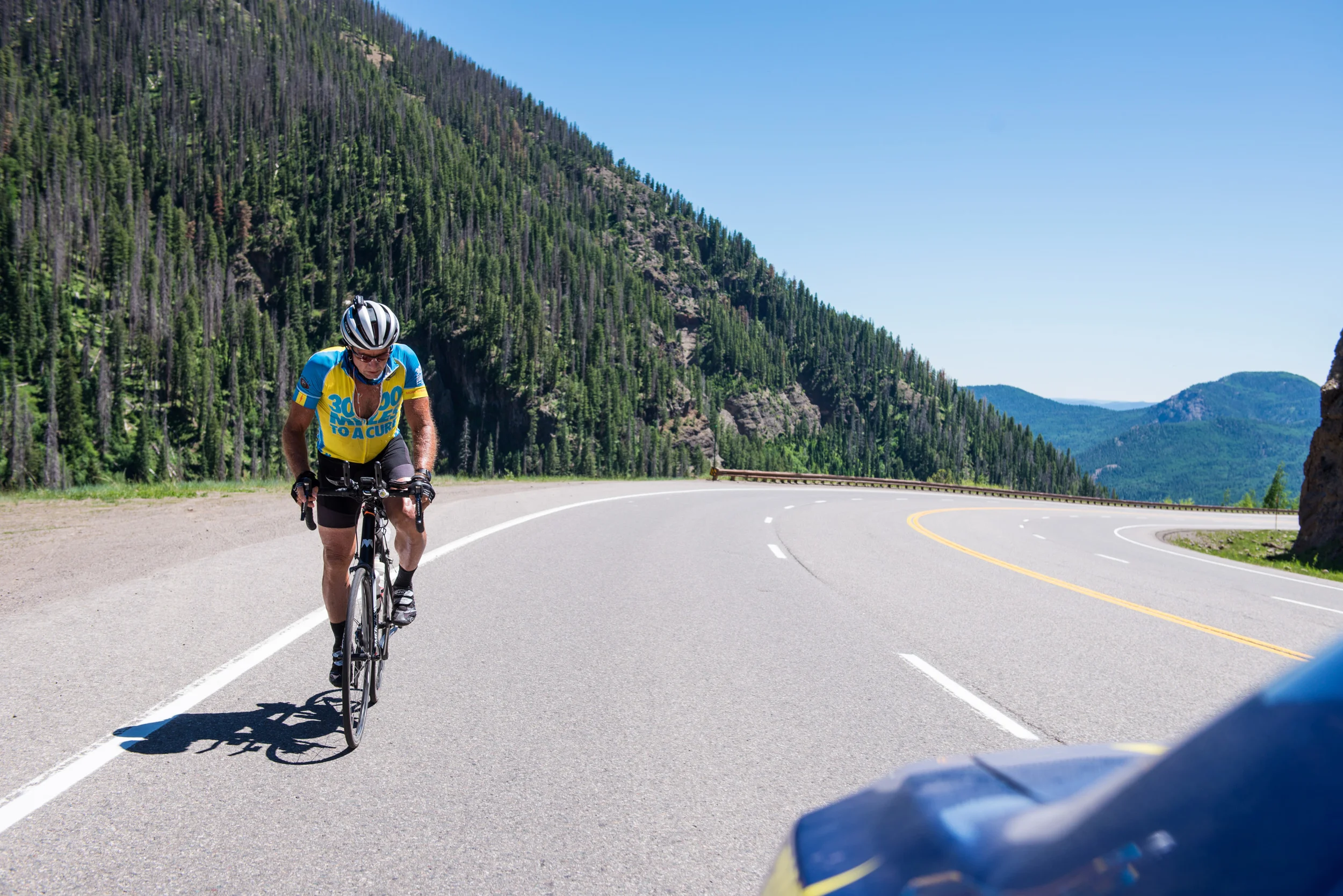 One of the more challenging parts of the race is the Wolf Creek Pass climb where cyclists have to climb up to 10,857 feet. The steep grade and lack of oxygen at such a high altitude make it difficult to get through. Marshall stands up to pedal through the pass on June 18th, 2016.