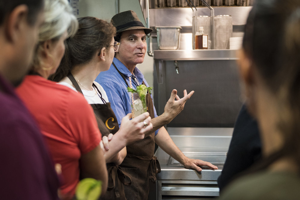  Roberto Copa Matos leads a cooking class in the kitchen of his restaurant, COPA. Before COPA opened, Roberto started a kickstarter in which people could contribute money that would be used to complete the interior of the restaurant. Those that donat