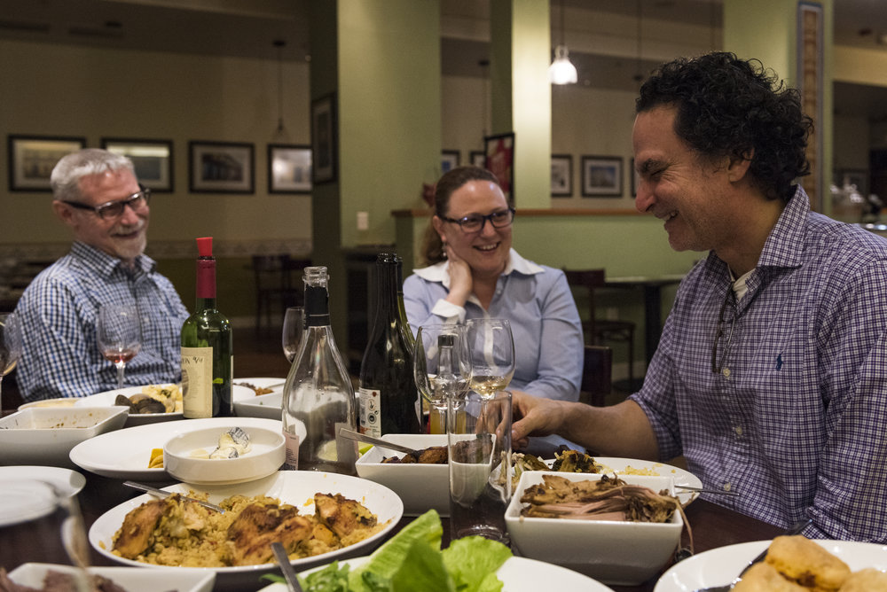  Roberto shares a laugh with his wife, Elizabeth Turnbull, and co-worker, Doug Addington, after the Saturday dinner shift ends. One Saturday's, Roberto serves all the leftover food so that his team members can have a nice meal before going home. 