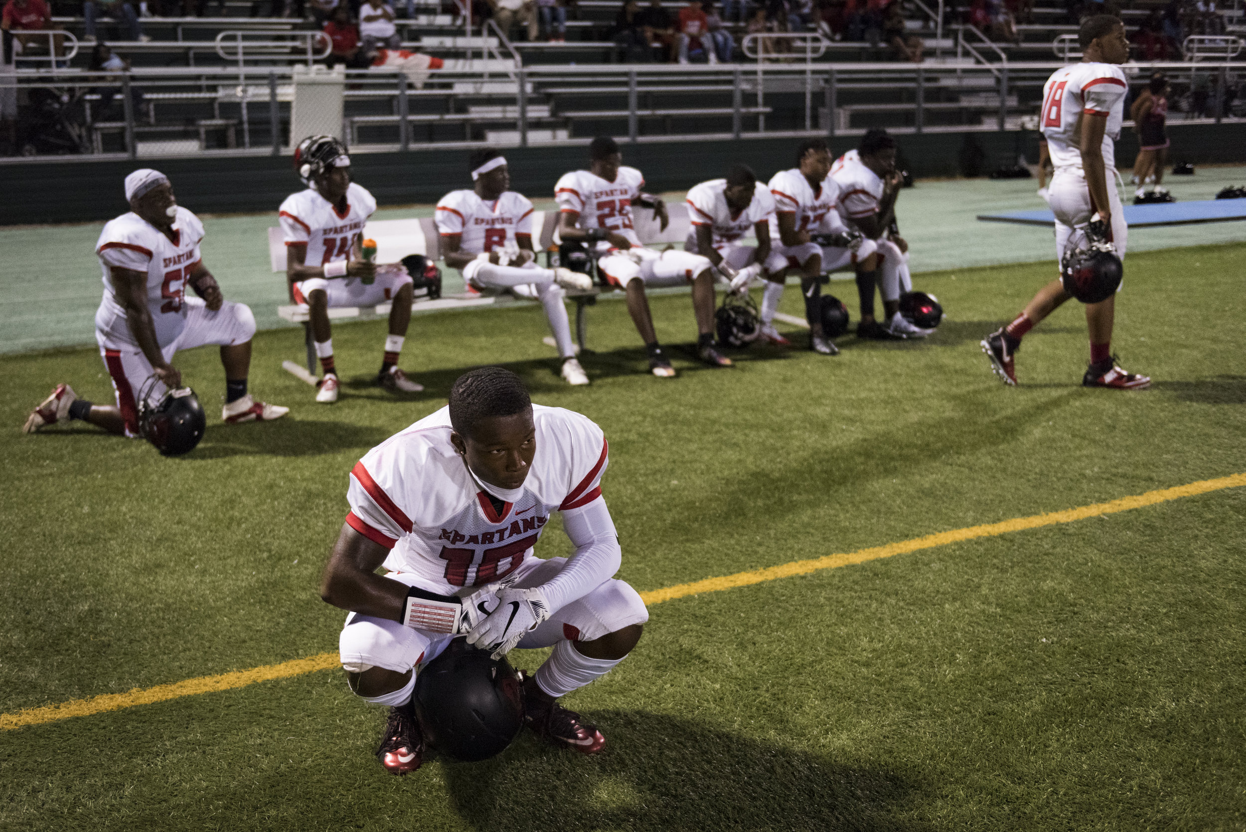  Southern Durham senior wide receiver Jaylen Lloyd watches on as the Spartans trail Cardinal Gibbons in the second game of the season. Lloyd would go on to have a productive season despite various injuries throughout. 