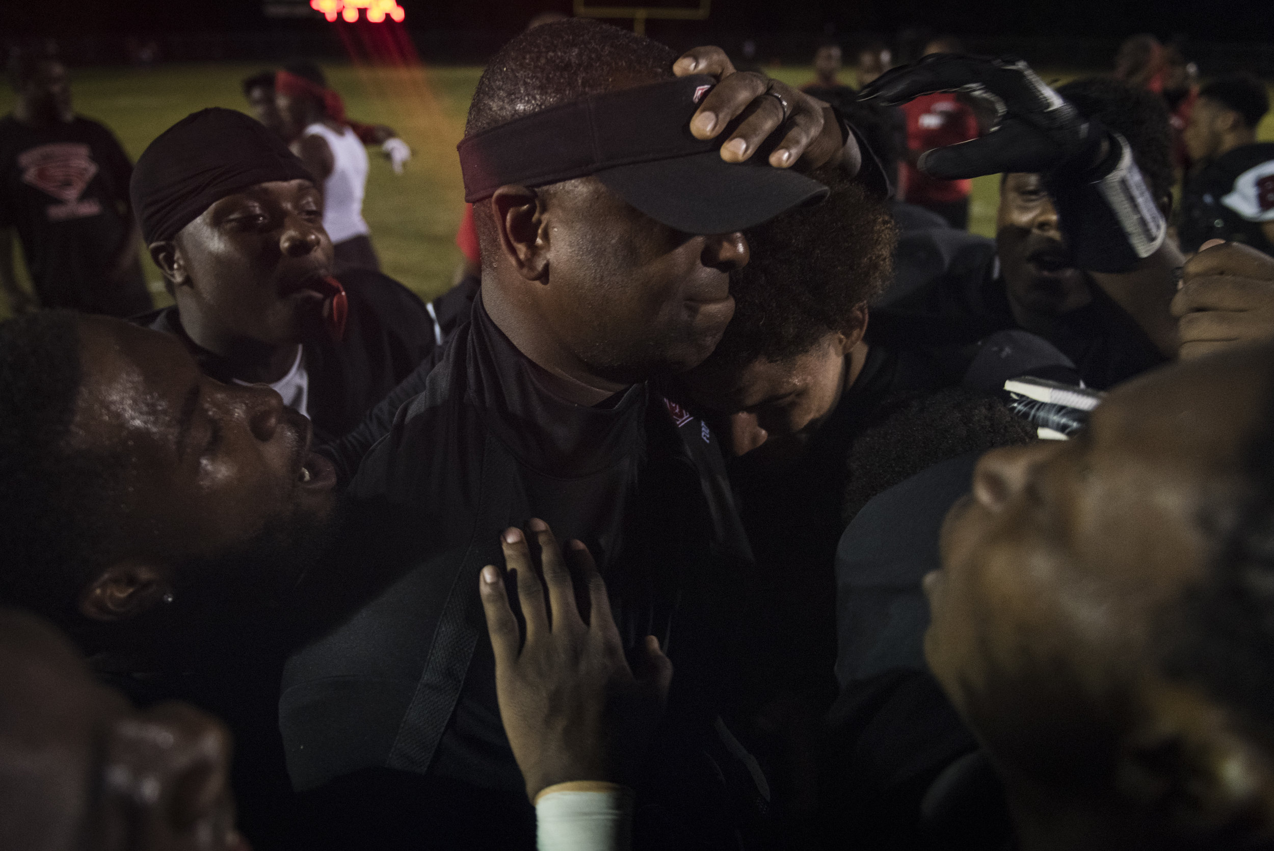  Southern Spartans head coach Darius Robinson celebrates with his players after an  upset win  against the No. 4 team in the region, Seventy-First High School. 