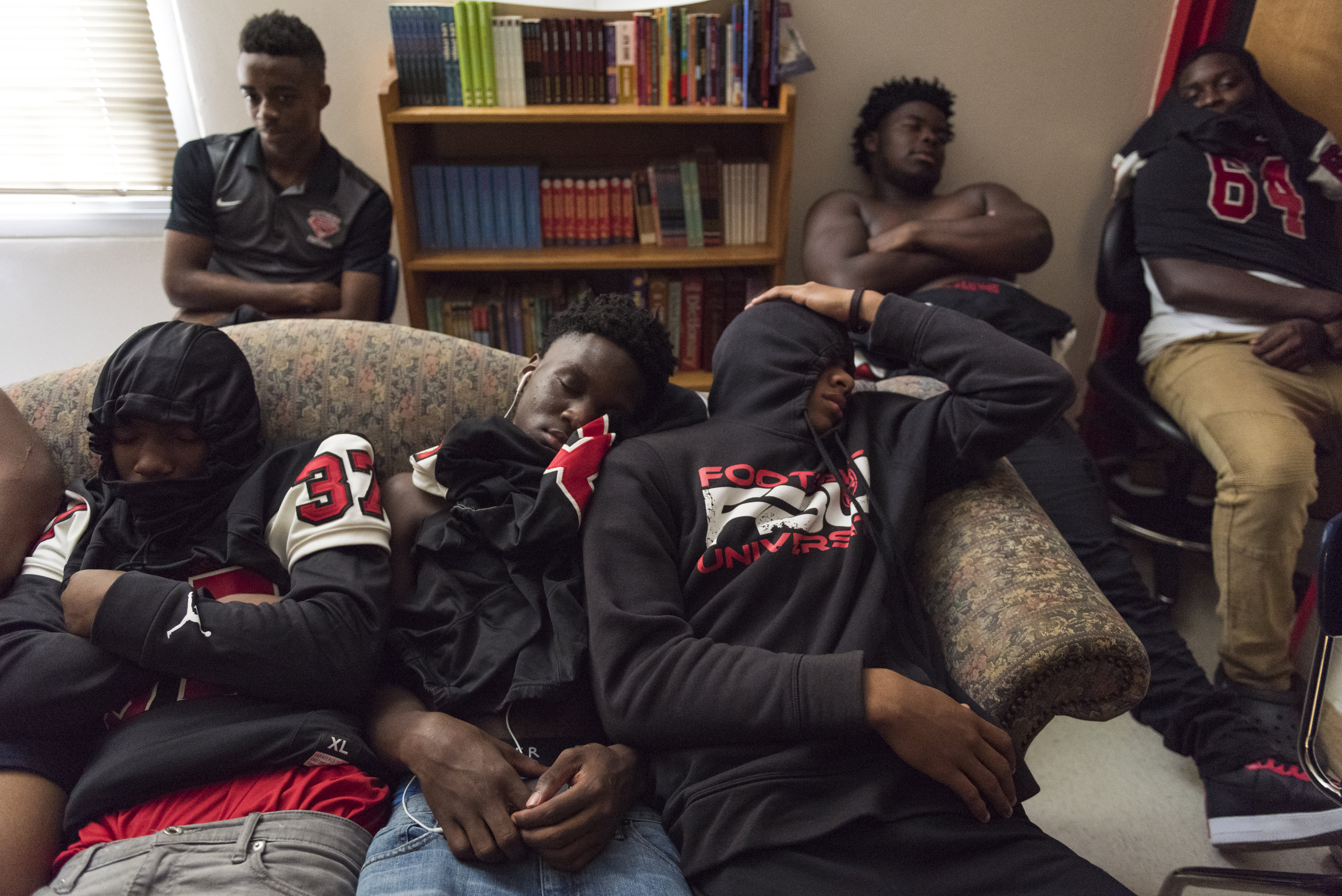  Southern Durham players take a quick nap before their game. During home game days, players usually have a team meal and then hangout in head coach Robinson's room before the game. 