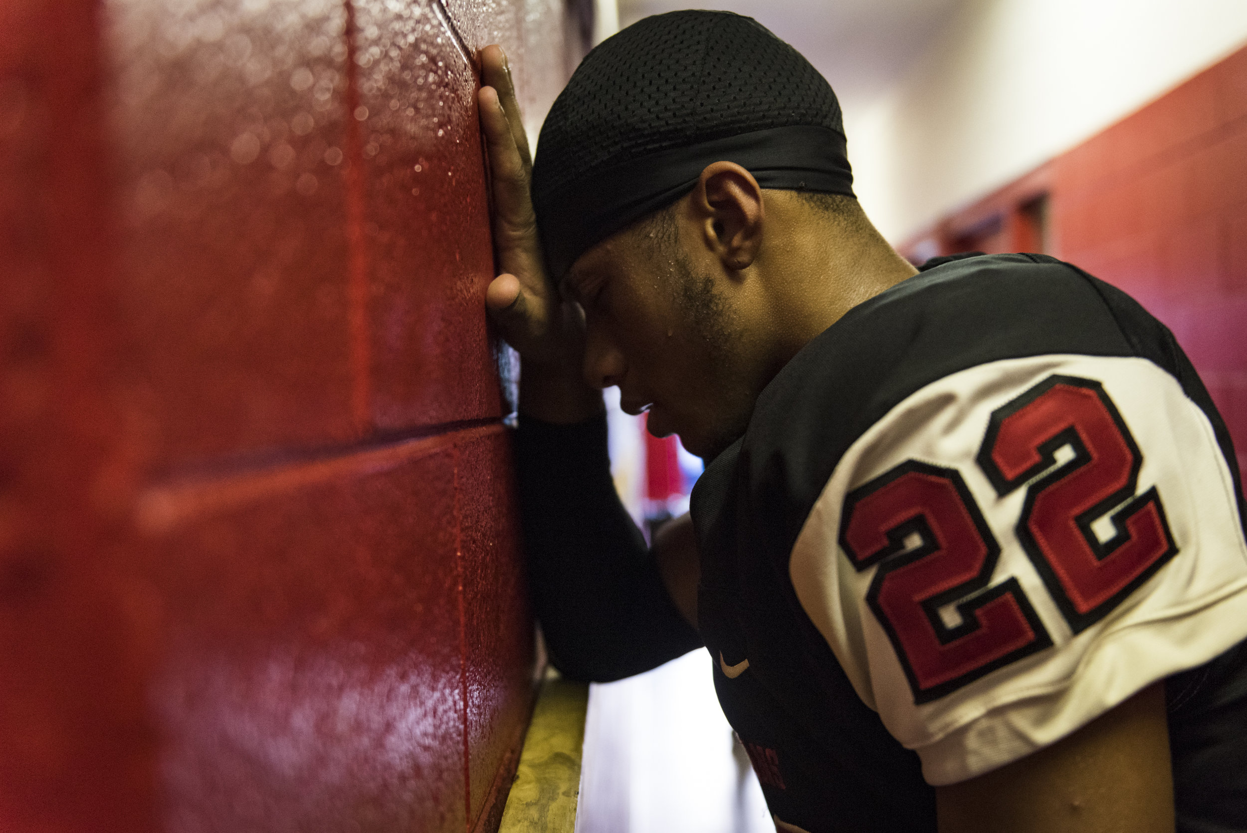  Southern Durham junior wide receiver Devin Smith prays outside the locker room before the team's game against No. 4 Seventy-First. 