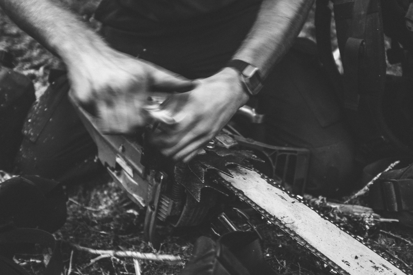  Fast hands working on getting a chain saw back in the fight. With limited resources at hand, cutters must become well-acquainted with small engine maintenance and be able to get a saw back up and running with maybe a bit of duct tape and a bar wrenc