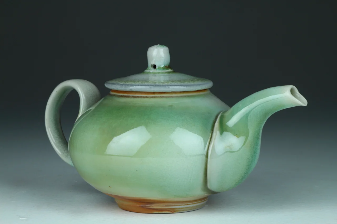 Teapot, 6" high, Glazed porcelain, soda chamber.