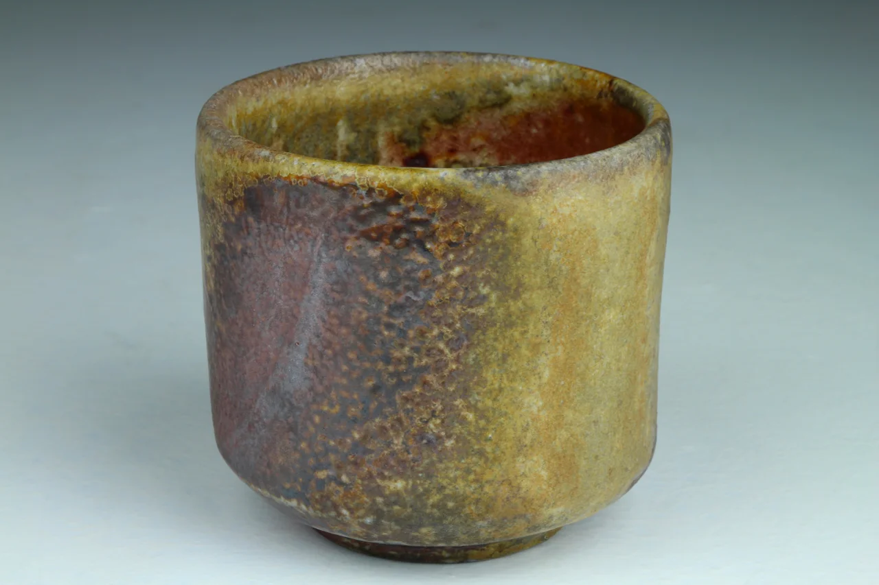 Sipper, 3" high, stoneware with local clay slip.