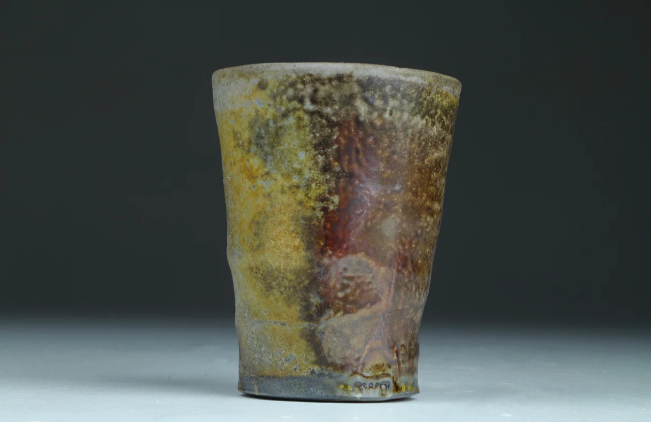 Shot glass, 2.5" high, stoneware with local clay slip.