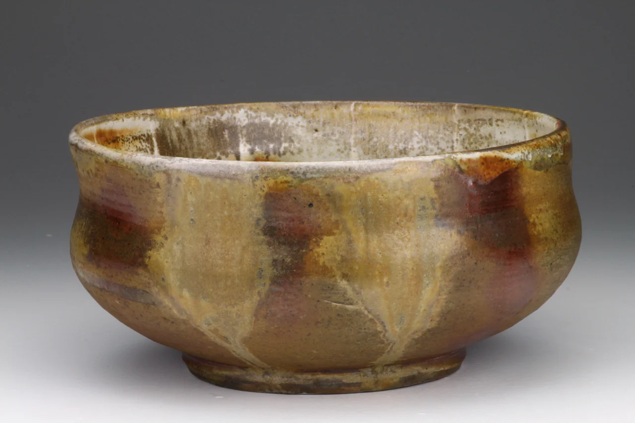 Bowl, 12" wide, stoneware with local clay slip.